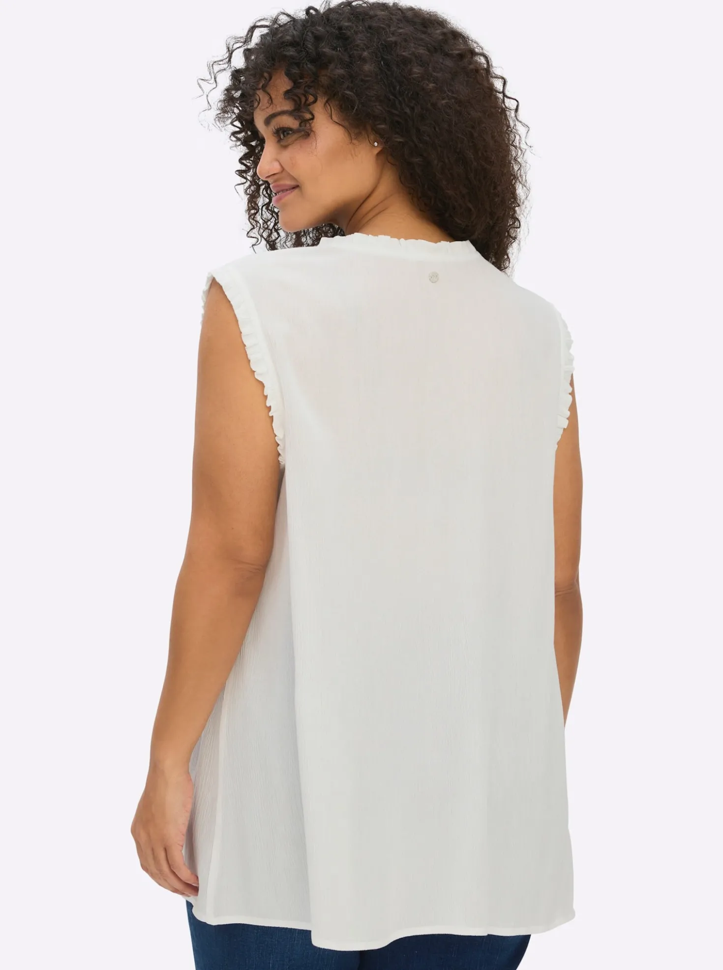 Ärmellose Bluse mit Rüschen und Stickerei